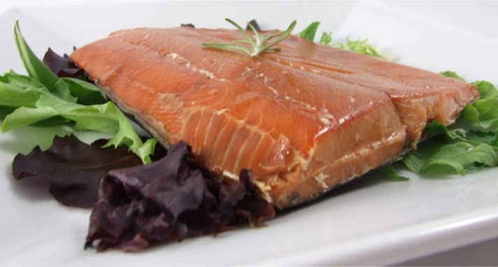 Alaska Smokehouse smoked salmon served on crackers offering easy entertaining idea