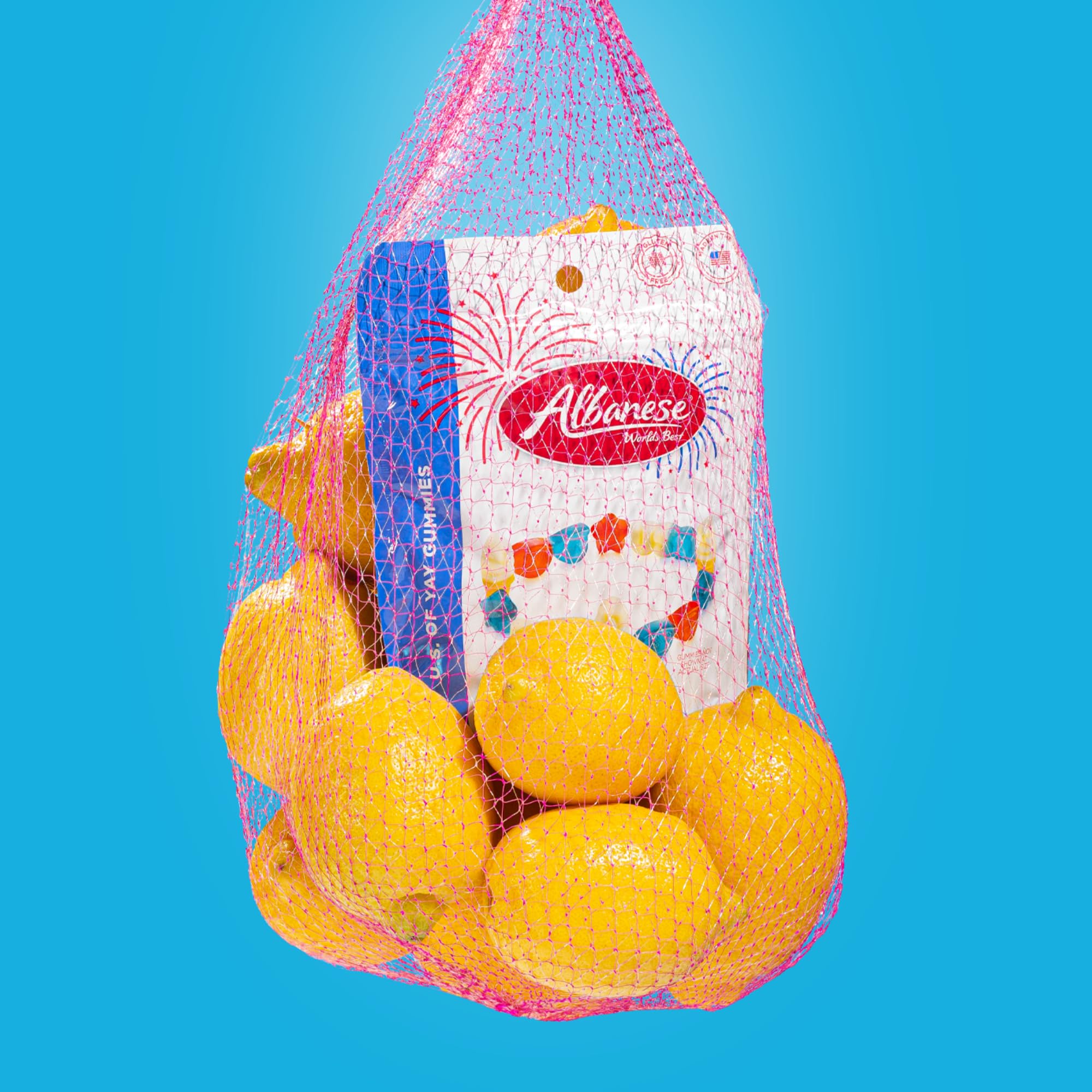 Albanese gummies on a picnic table enhancing summer party snack appeal