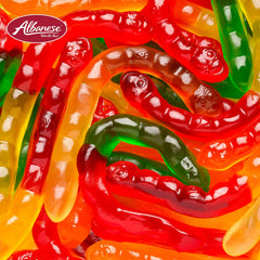 Albanese gummy worm held in hand to show size and generous portion per piece