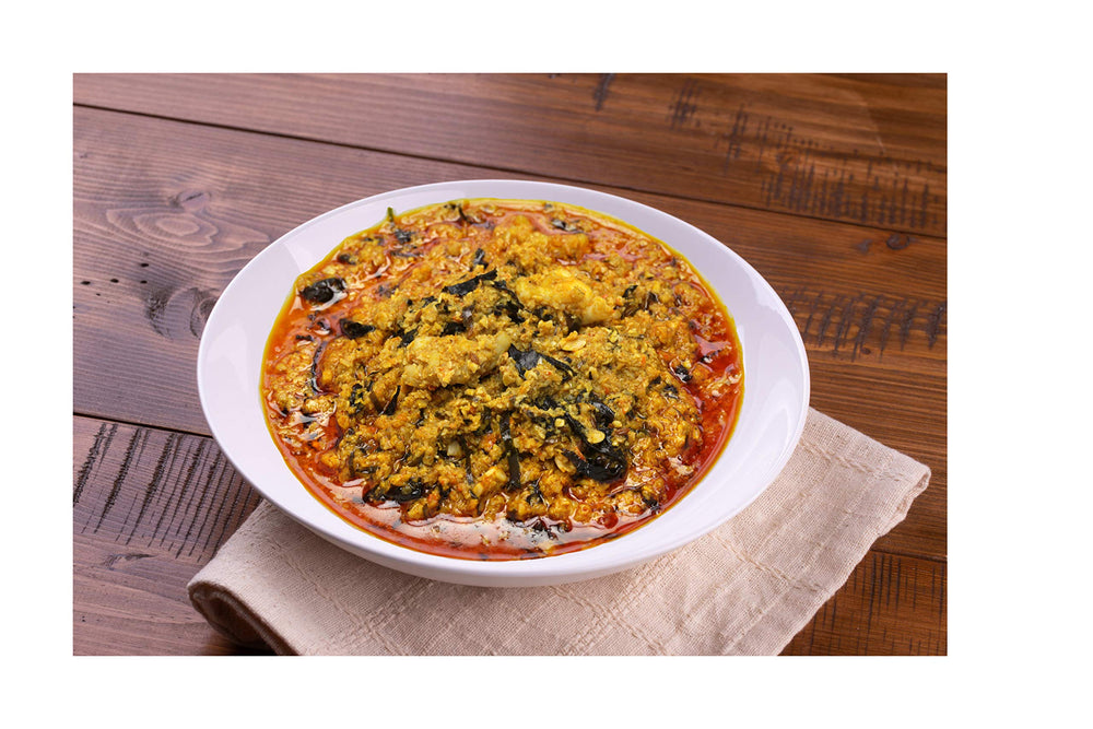 Albasa egusi served in bowl with fufu lifestyle shot for family meal