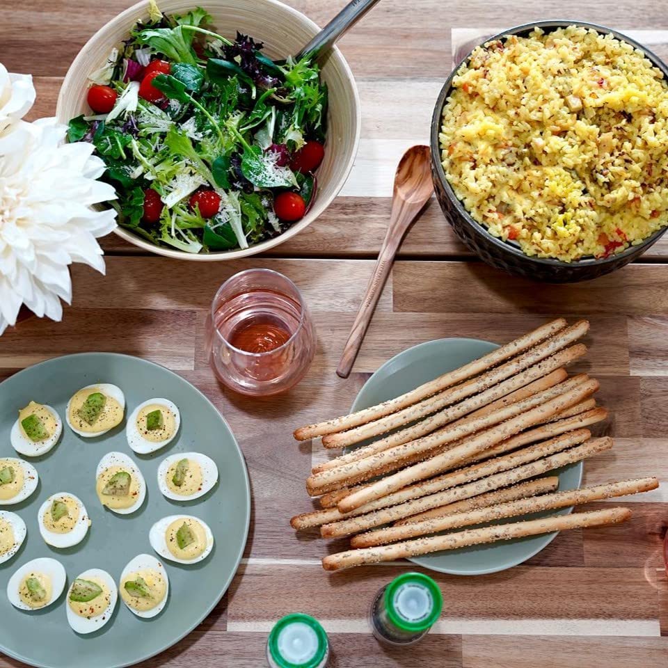 Alessi breadstick dipped in hummus showing dipping compatibility