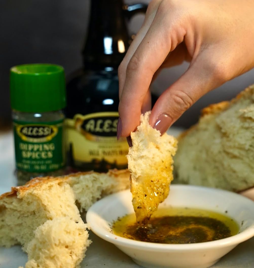 Alessi tabletop serving with grinders and bread, perfect for entertaining