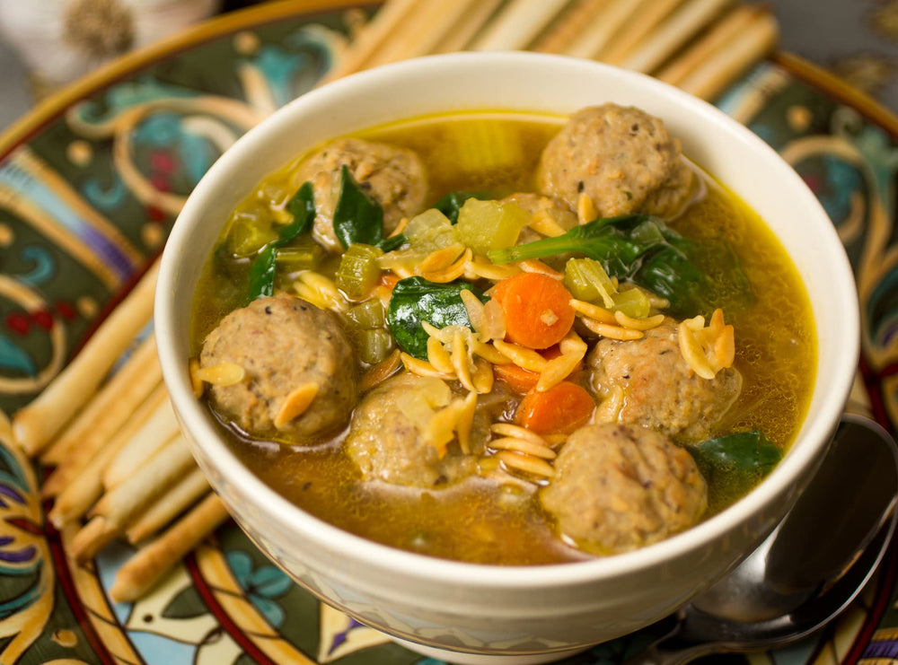 pot on stove with Alessi soup simmering to show easy home preparation