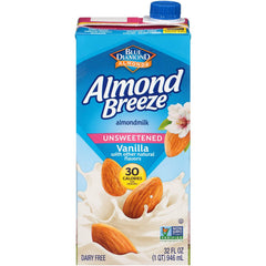 Almond Breeze being poured into a coffee mug for creamy flavor