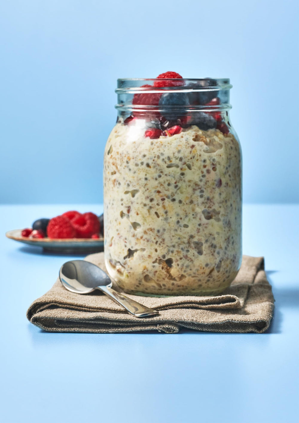 Alpen Museli No Added Sugar 950g next to a measuring cup showing large family size