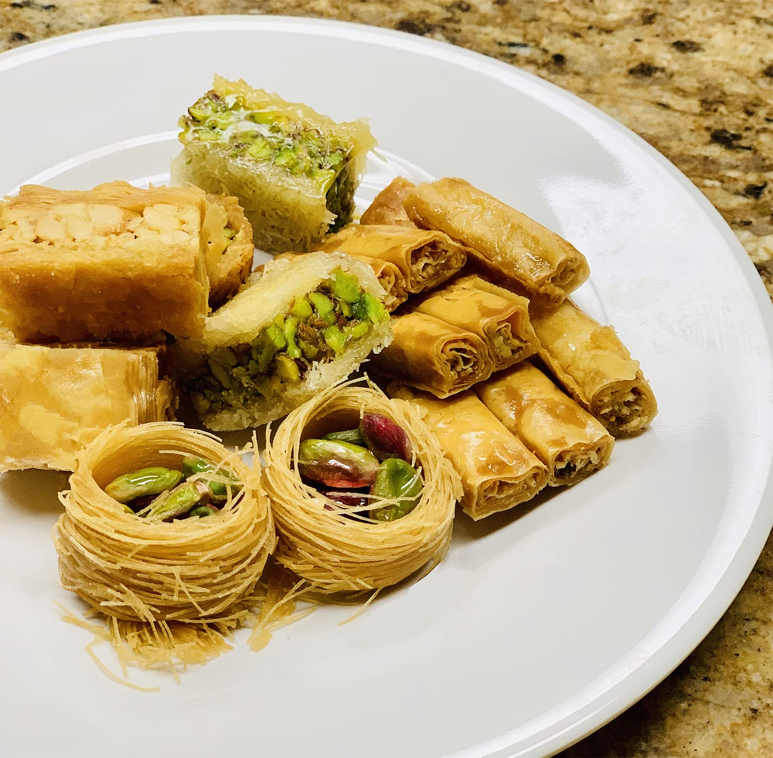 Alreef baklava next to a coffee cup for size comparison and portion guidance benefit