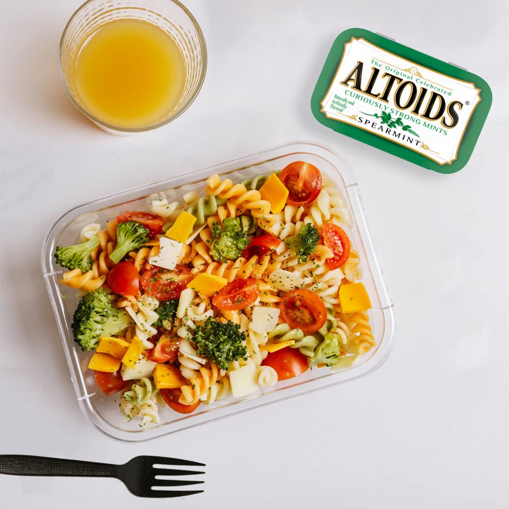Altoids tin in a pocket to demonstrate portable fresh breath