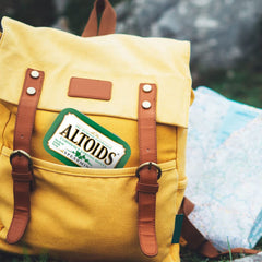 Twelve Altoids tins grouped to highlight pack value and convenience