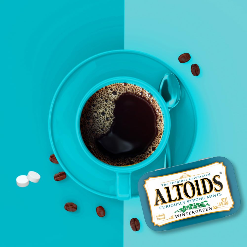 Altoids tin beside a quarter showing size and easy pocket fit