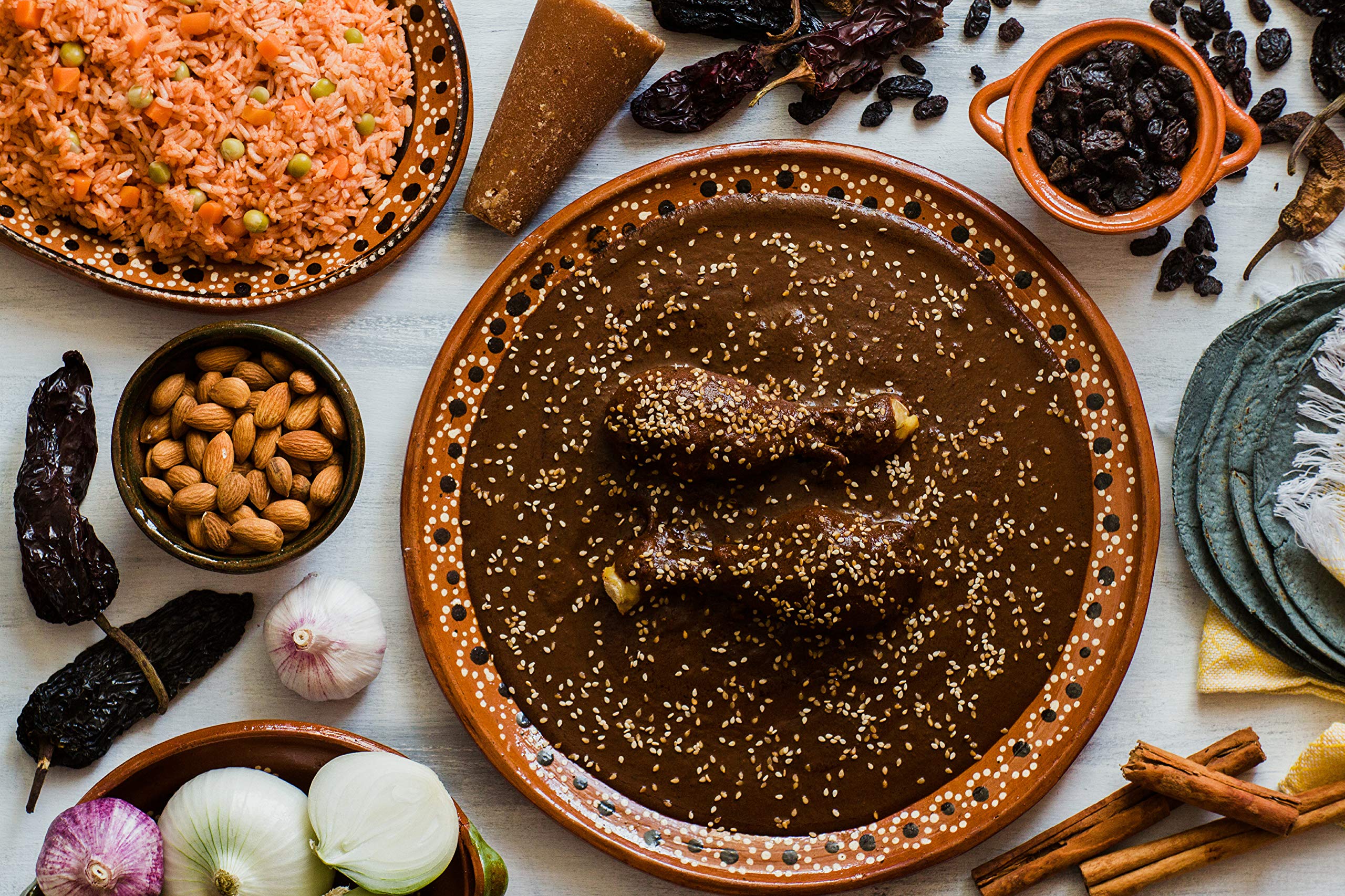 Amazing Chiles & Spices powder next to mole ingredients, accelerates sauce prep