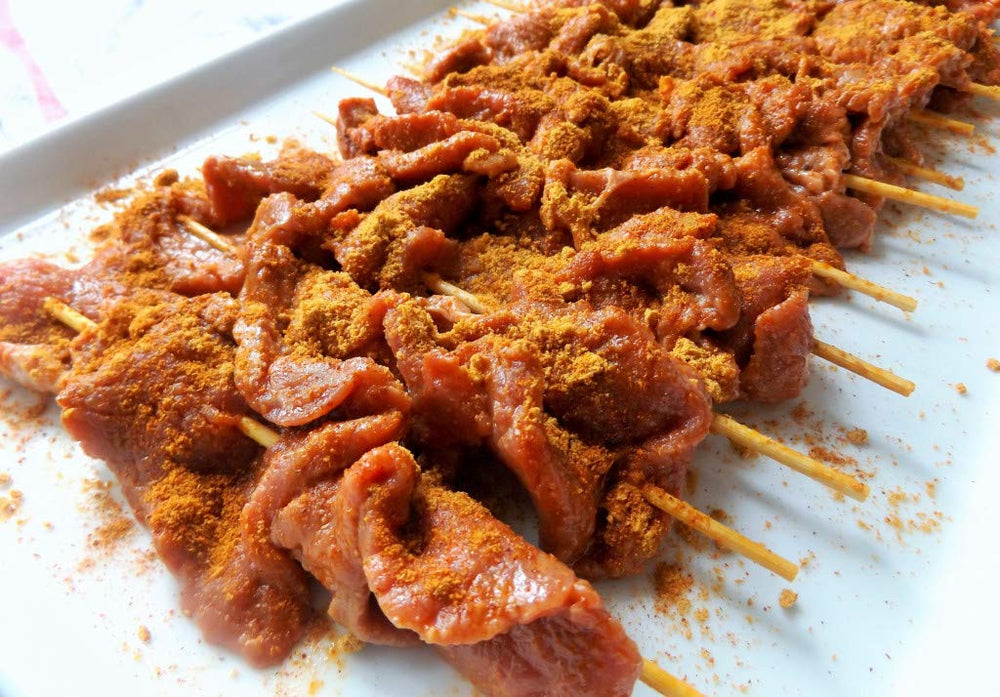 Aminchi Foods rubbed on grilled steak, adds bold crust and savory appeal