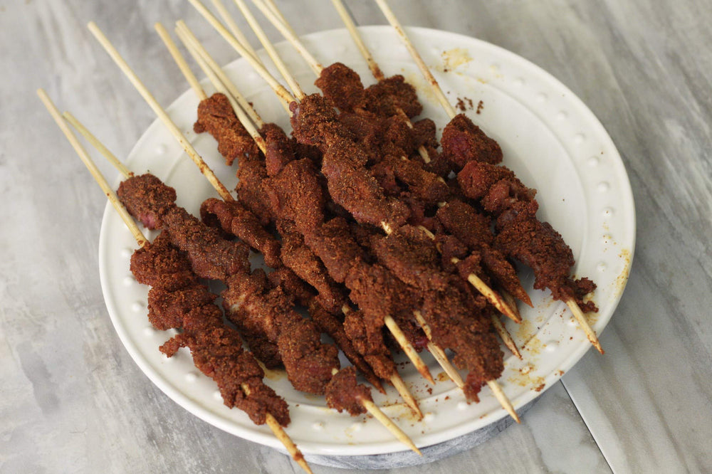 Aminchi Foods close-up of spice texture, reveals crunchy peanut and pepper bits