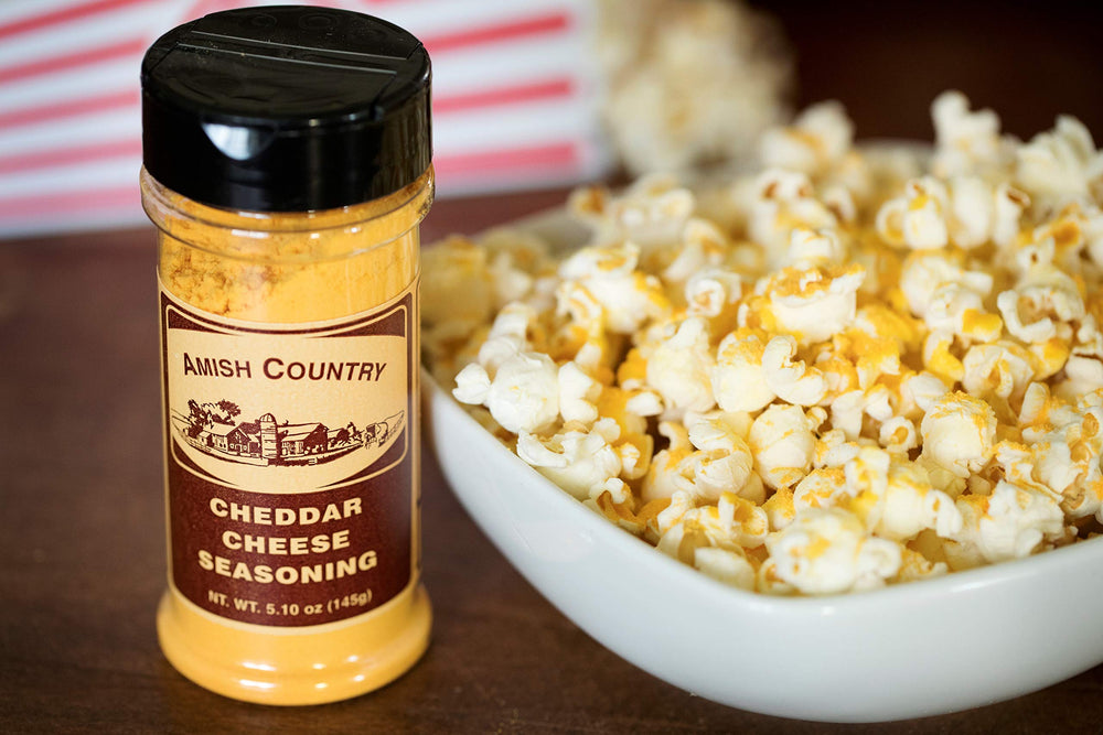 Amish Country Popcorn seasoning sprinkled on popcorn showing enhanced flavor and visual appeal