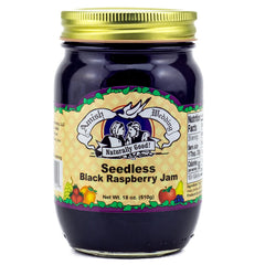 Amish Wedding jam close-up spread on a spoon highlighting smooth seedless texture and rich color