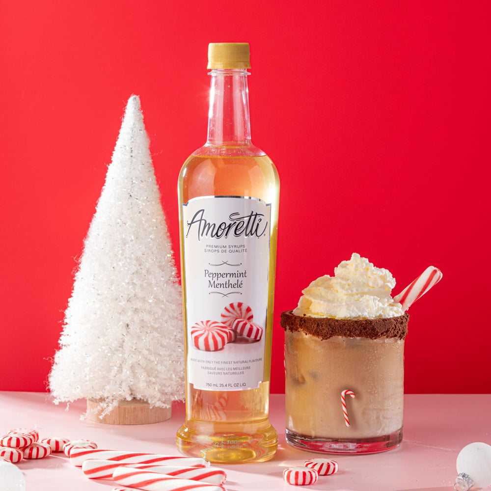 Amoretti peppermint syrup bottle beside a ruler for size comparison and economical serving benefit