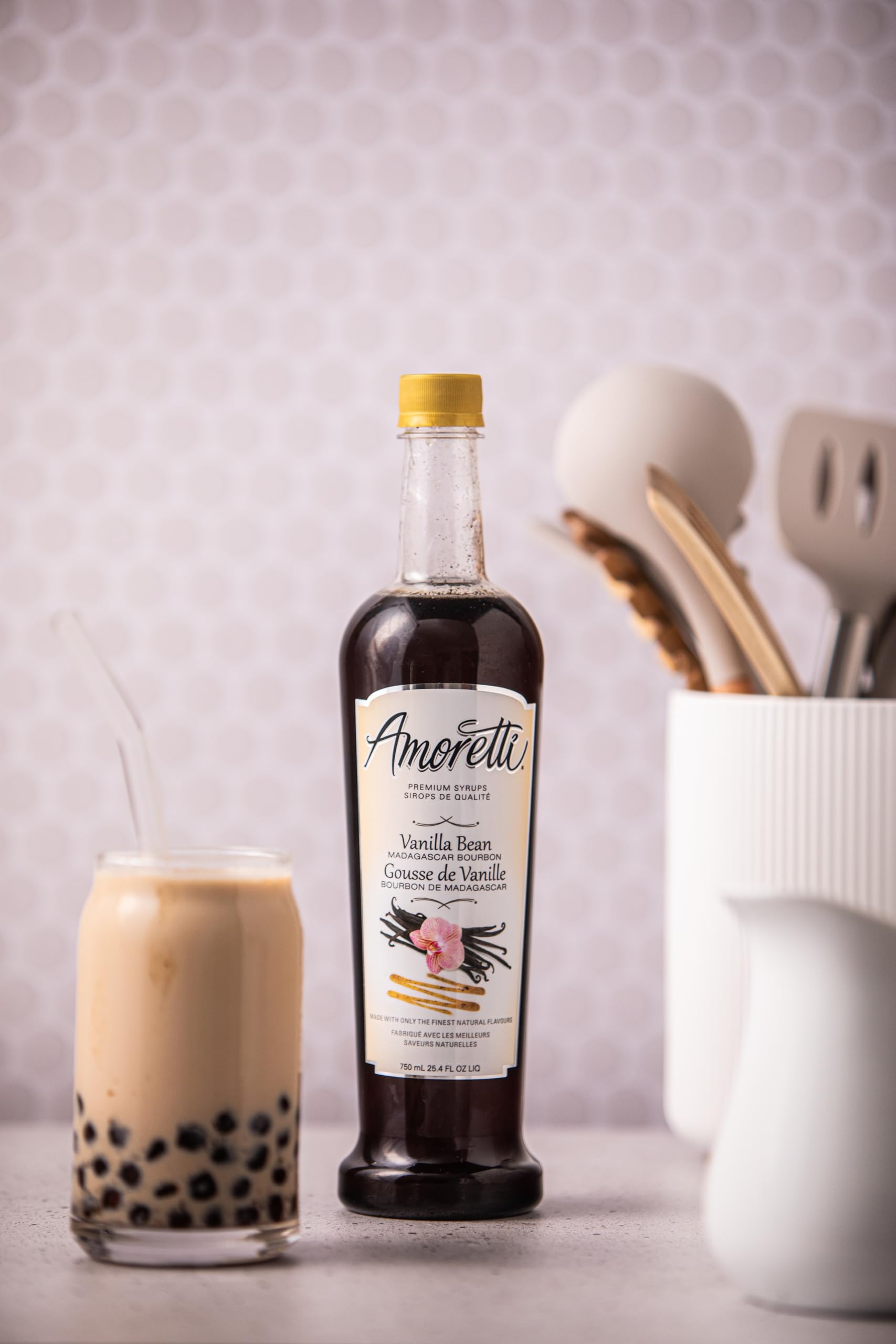 Amoretti syrup poured into coffee and cocktail showing versatile beverage use