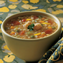 Amy's open can showing hearty barley and mixed vegetables for quick meals