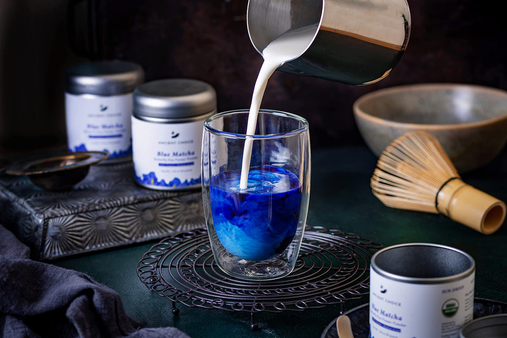 Ancient Choice prepared blue matcha latte in cup, vibrant color and creamy texture