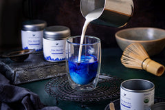 Ancient Choice prepared blue matcha latte in cup, vibrant color and creamy texture