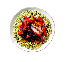 Portion of Ancient Harvest quinoa in measuring cup for precise meal prep