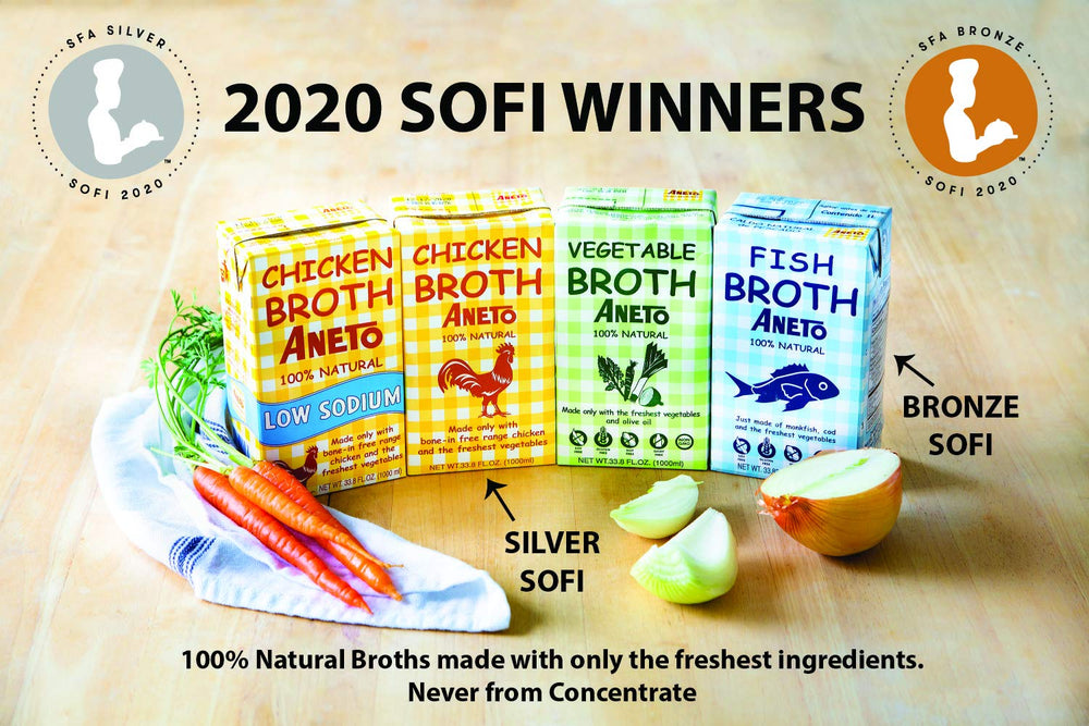 Hand holding Aneto broth carton to show size and everyday kitchen convenience
