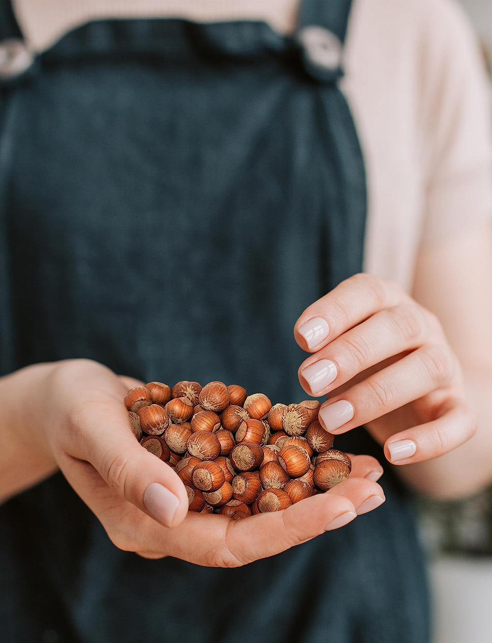 Anna and Sarah hazelnuts mixed into granola demonstrating recipe versatility