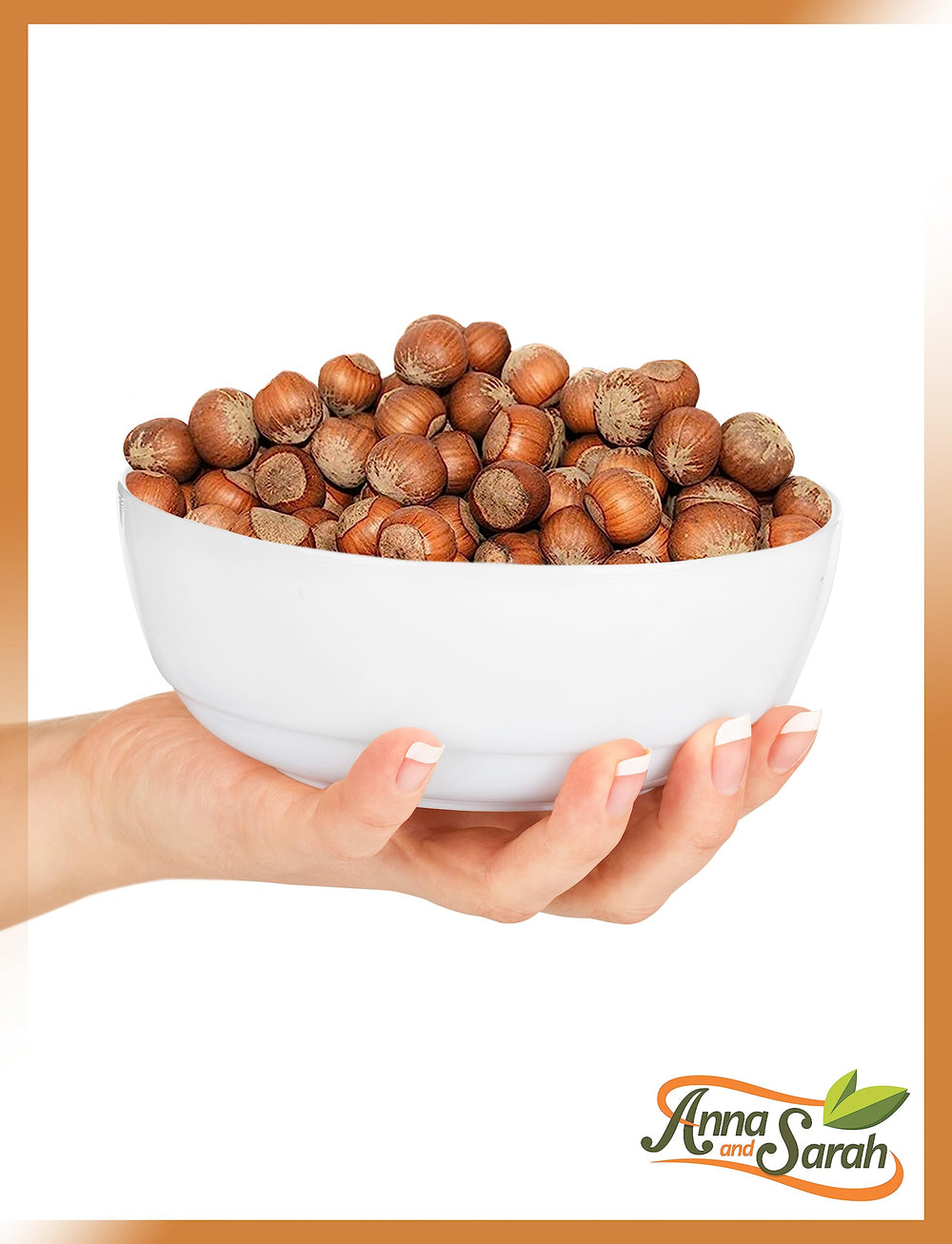 Anna and Sarah hazelnut beside a hand for scale showing large filbert size benefit