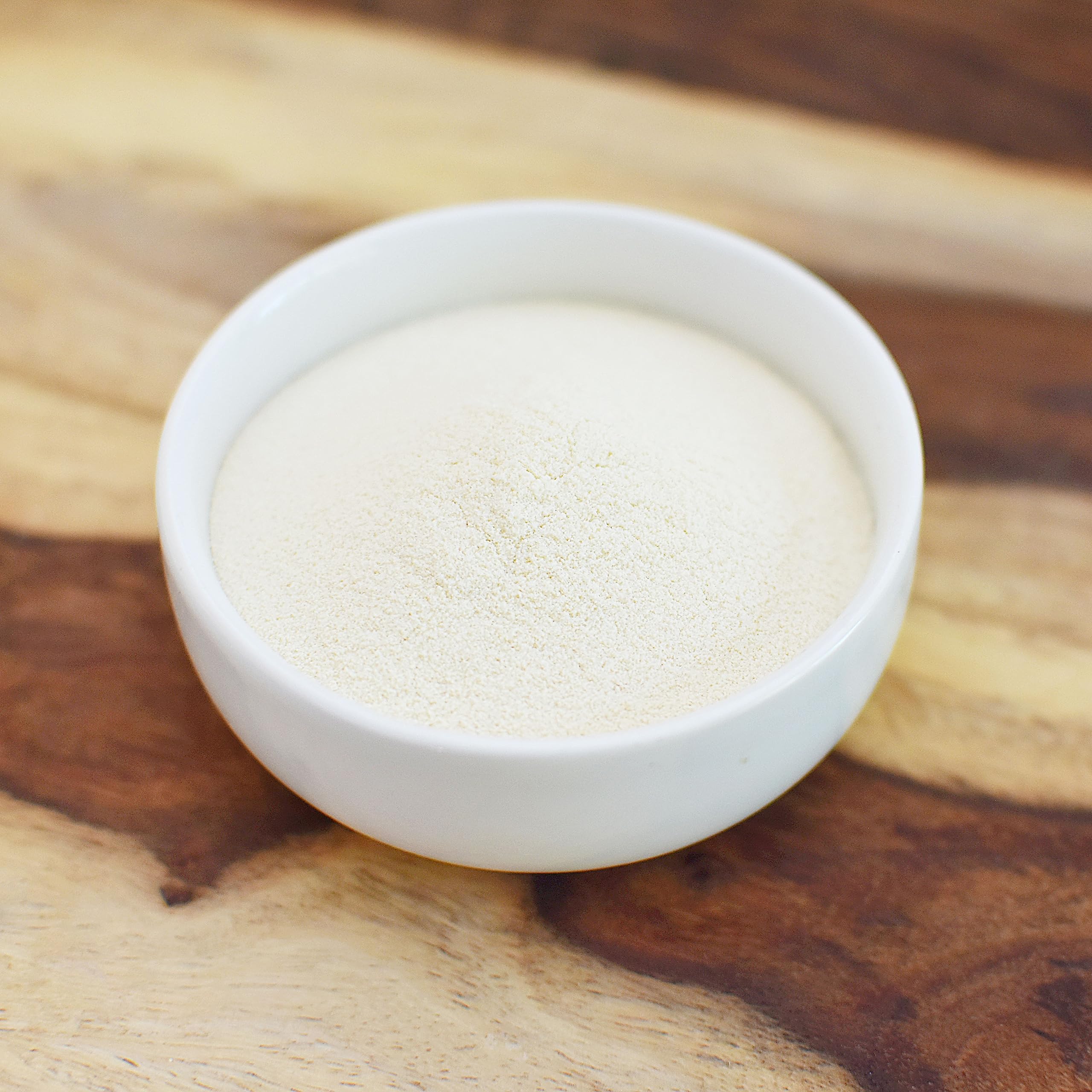 Anthony's malted powder beside flour and eggs showing baking use and versatility