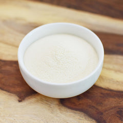 Anthony's malted powder beside flour and eggs showing baking use and versatility
