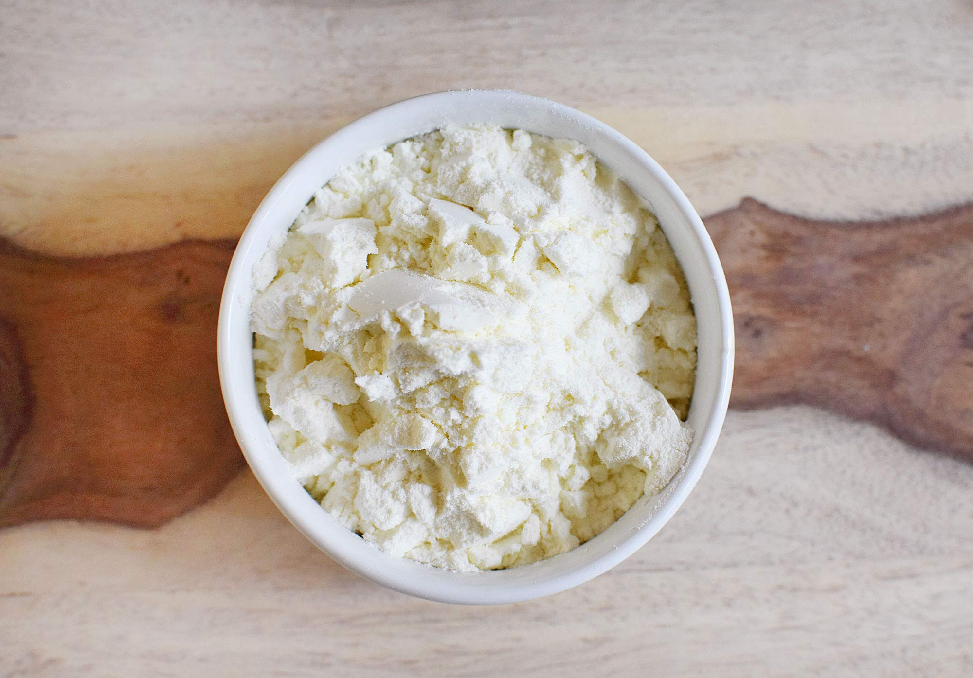 Anthony's measuring scoop with powder illustrating accurate portions and easy use