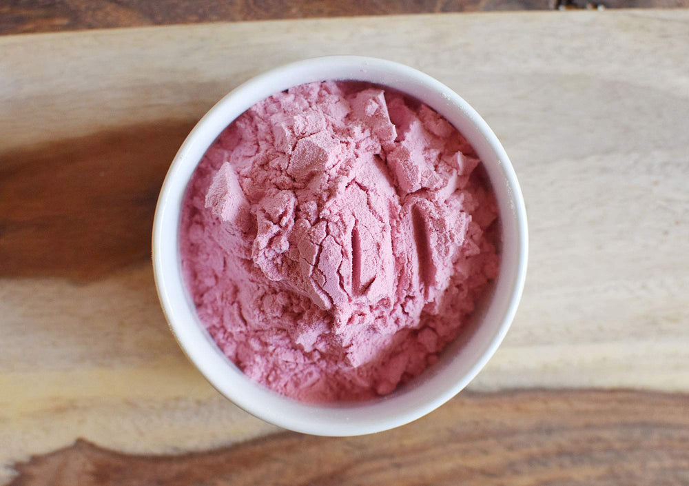 Anthony's powder dissolved in a glass illustrating quick mixability and bright color