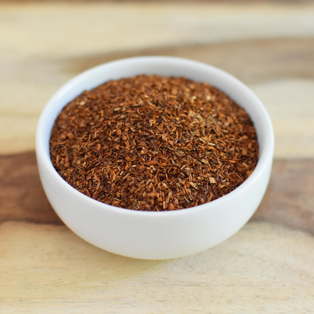 Anthony's tea steeping in glass pot demonstrating infusion clarity and bold red hue
