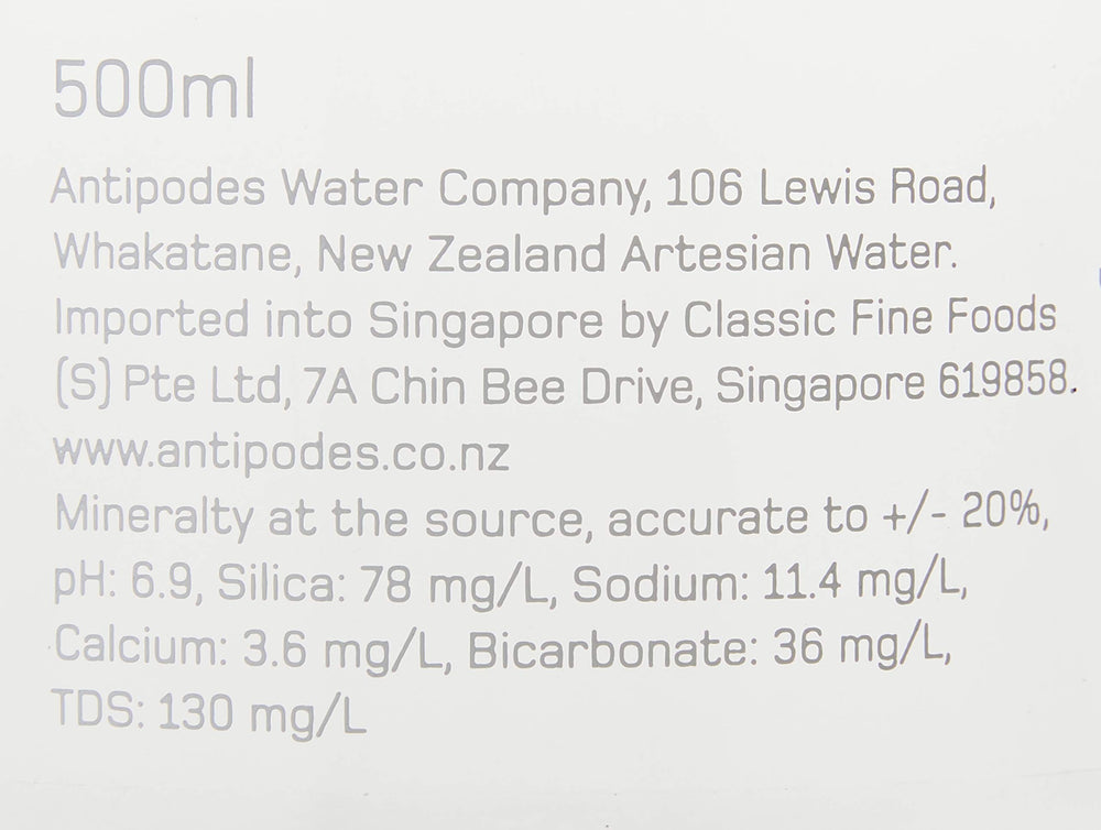 Antipodes bottle close-up label highlighting source details and sustainable glass benefit