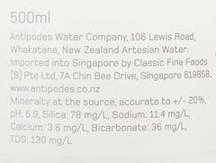 Antipodes bottle close-up label highlighting source details and sustainable glass benefit