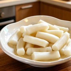 APEYX rice cakes arranged in a bowl ready to cook for convenience