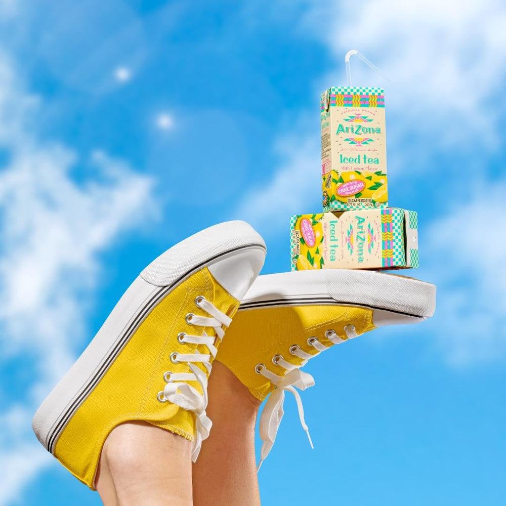 AriZona carton held in hand to show scale, easy-to-carry single-serve benefit