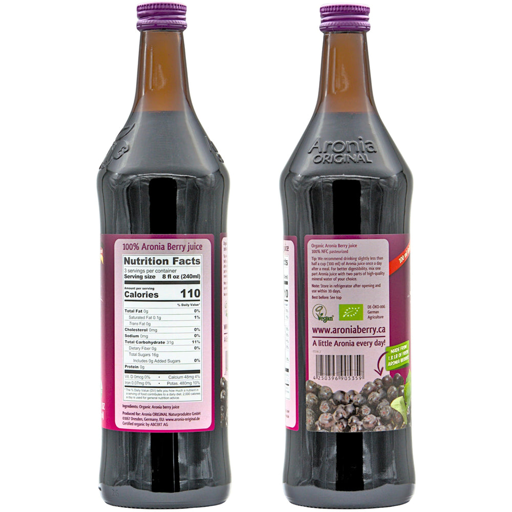 Aronia Original bottle with raw black chokeberries showing whole fruit origin