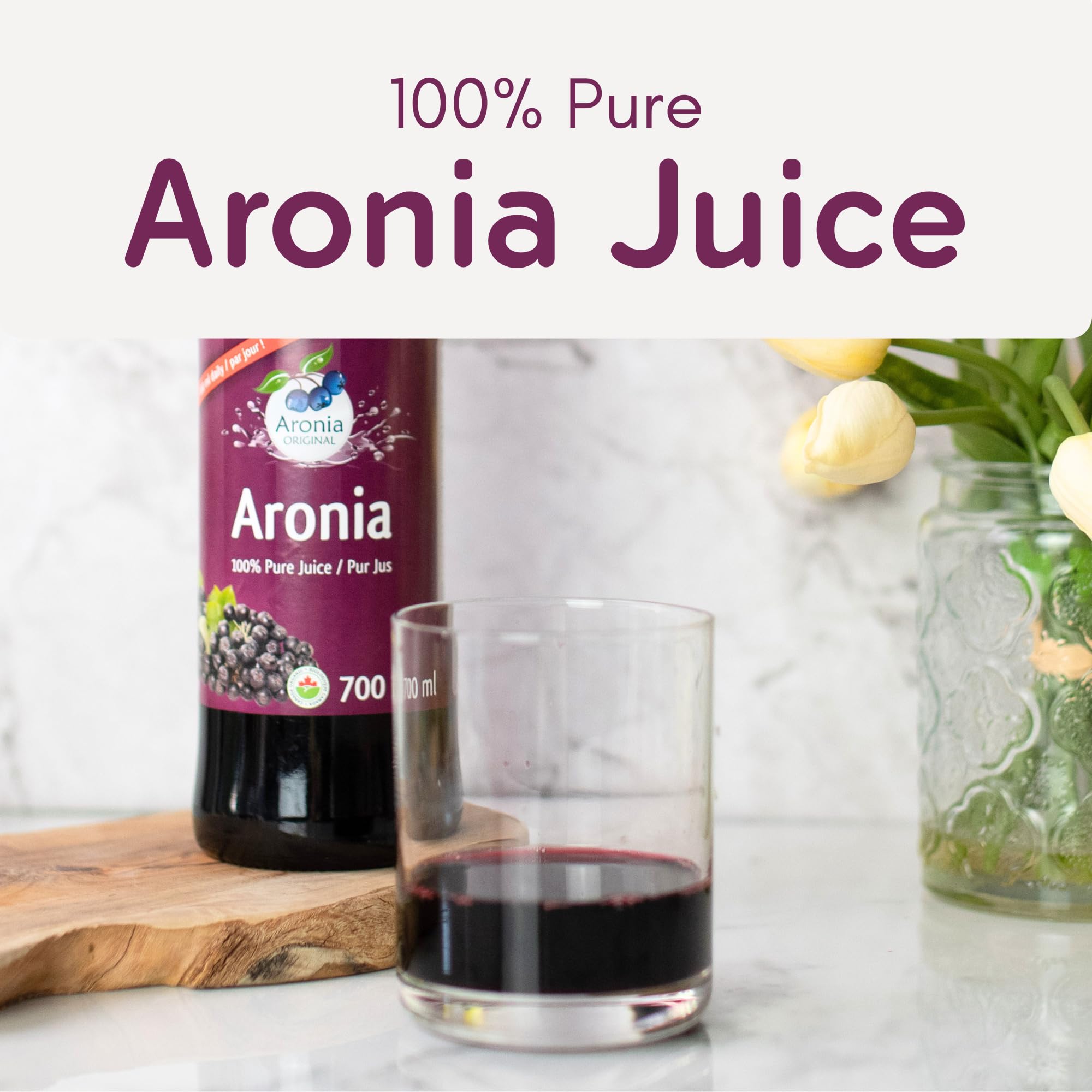 Aronia Original pouring juice into a chilled glass to add bold berry taste