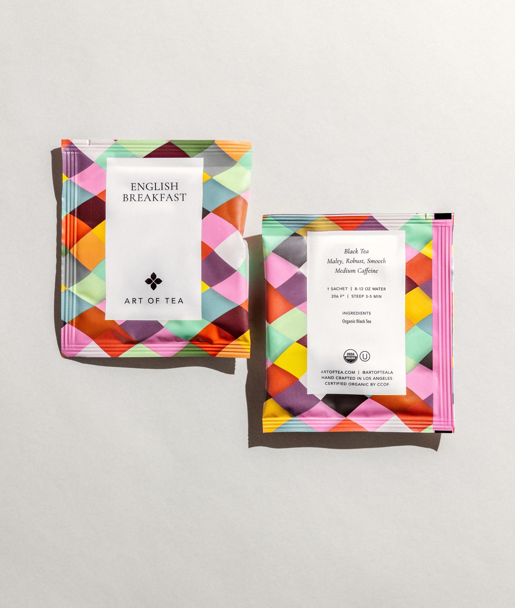 Art of Tea pyramid sachet close-up revealing whole-leaf expansion for fuller flavor