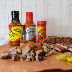Arthur Bryant's Rich & Spicy sauce texture drizzling to show bold seasoning and grilling appeal