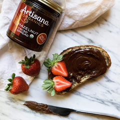 Artisana close-up hazelnuts and cacao pieces showing premium ingredients