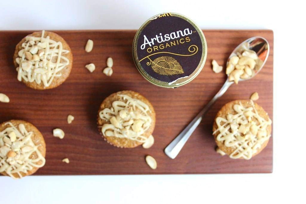 Artisana raw almond butter with raw almonds emphasizing family-farm origin