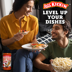 ASS KICKIN' sprinkled on popcorn delivering spicy tang and popcorn upgrade benefit