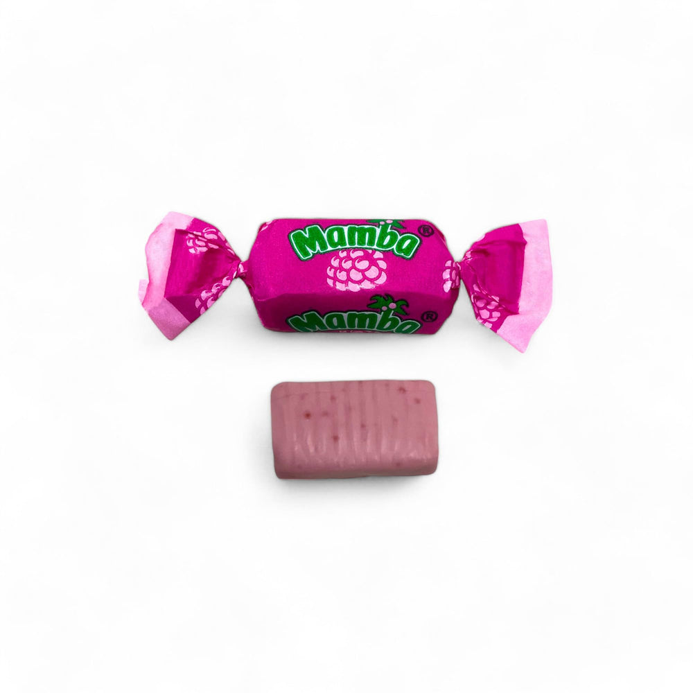 Assortit Mamba raspberry next to a hand for scale showing portion size