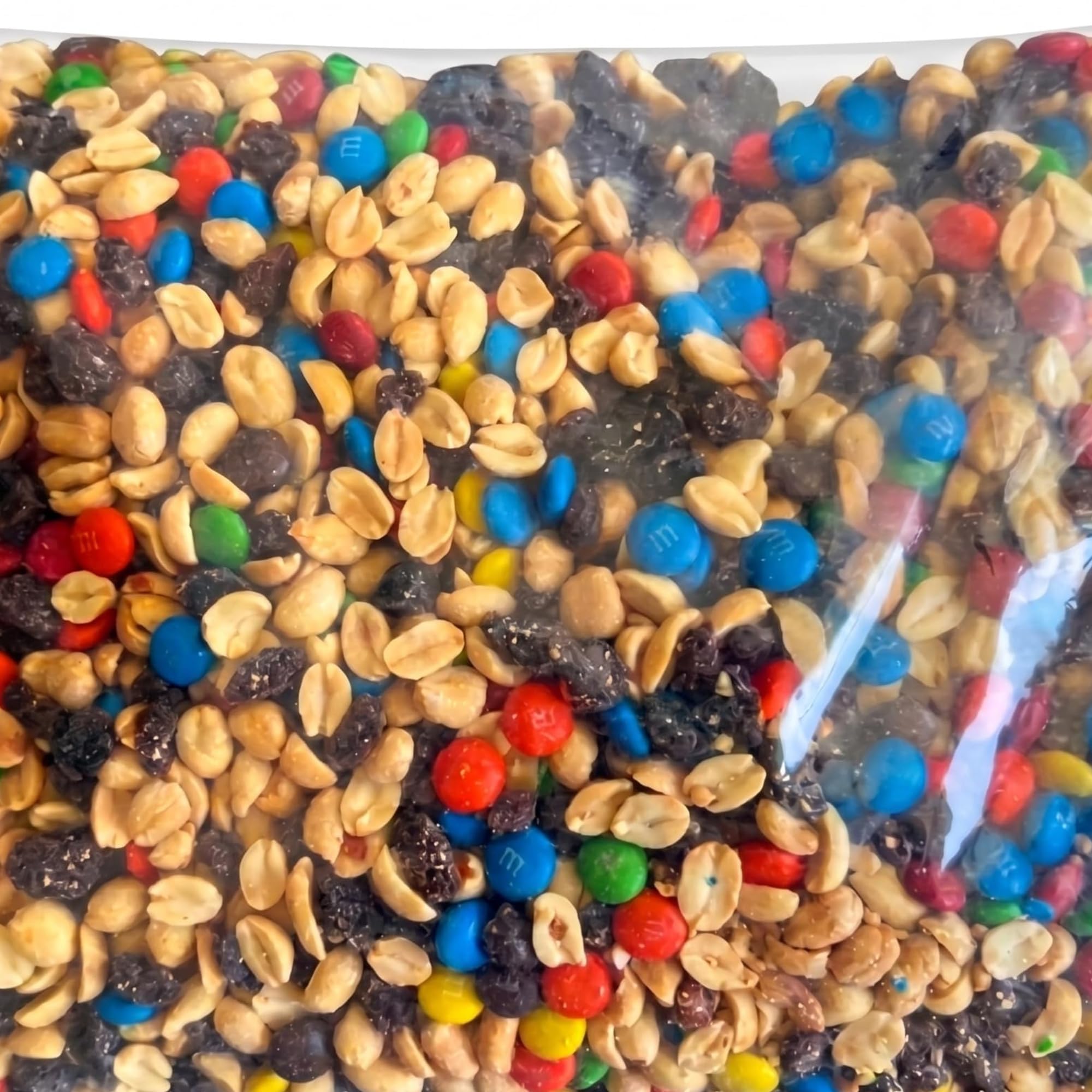 Close-up of Assortit mix texture highlighting peanuts raisins and M&M'S for visible variety