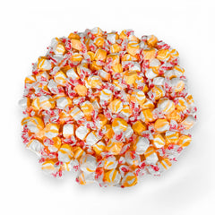Assortit unwrapped taffy close-up showing soft texture and creamy peach swirls