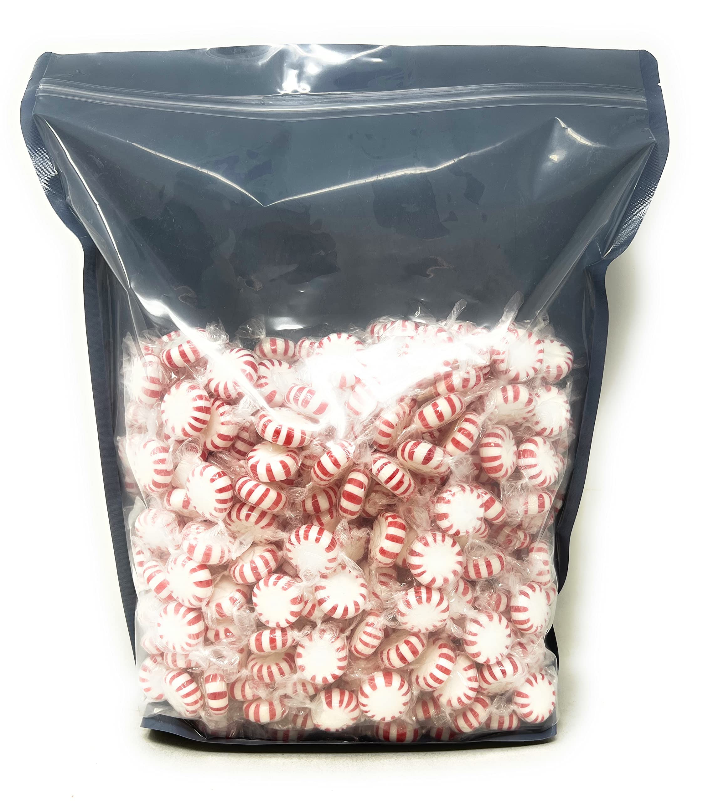 Assortit individually wrapped mints in hand highlighting hygiene and easy sharing benefit