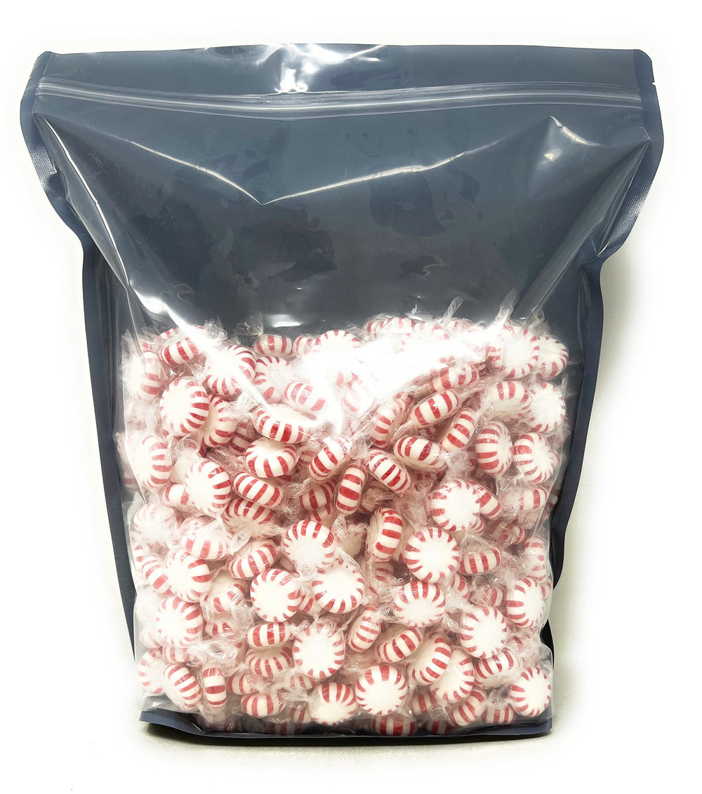 Assortit individually wrapped mints in hand highlighting hygiene and easy sharing benefit