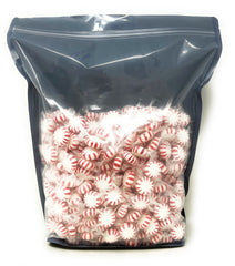 Assortit individually wrapped mints in hand highlighting hygiene and easy sharing benefit