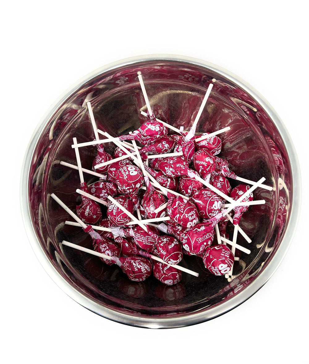 Assortit close-up of red raspberry Tootsie Pop texture highlighting candy shell